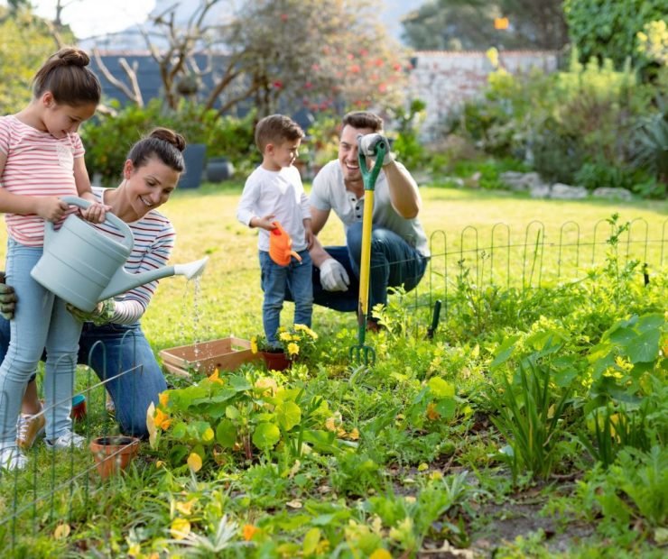 happy-caucasian-family-gardening-and-watering-plants-together.jpg